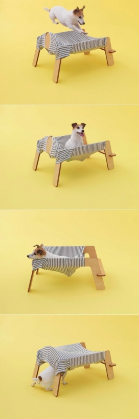 宠物狗狗的针织木质弹跳床-日本Torafu设计师作品，最初的设计灵感来自于一个非正式的遭遇，通过仔细观察，设计师发现，狗总是接近衣服的主人-令人放心的香味和愉快触摸织物。