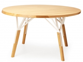 完美简约的圆形桌-桌腿是由轻木和激光切割弯曲钢板组成，并连接到桌面，像一把刀子