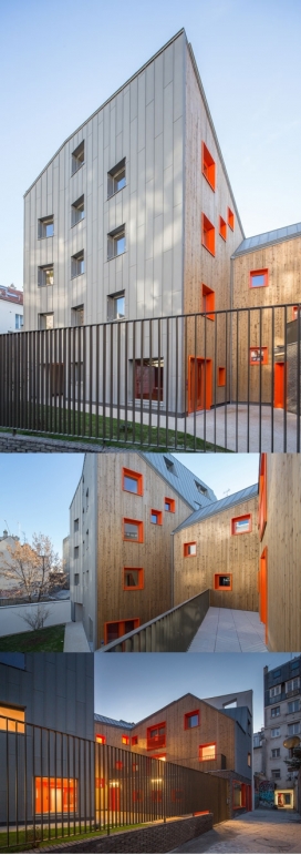 巴黎橙色狭槽公寓楼-高六层，形状不规则的大胆橙色窗口