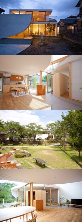 弯曲的墙壁公园公寓-在日本滋贺县琵琶湖，视图附近是一个绿意葱葱公园，房屋有一排瓷砖斜屋顶，白色的墙壁，木地板，创造了与当地强烈的绿化视觉连接